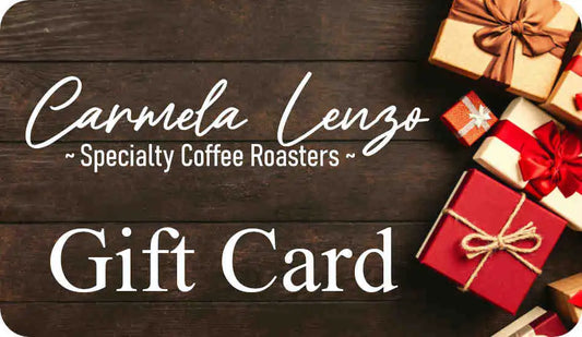 Carmela Lenzo Specialty Coffee Roasters gift card with decorative boxes on a wooden background